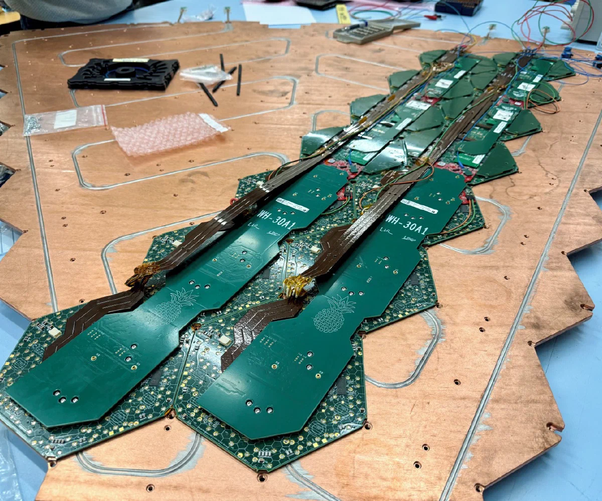 Hexagonal CMS High Granularity Calorimeter modules arranged on a copper cooling plate